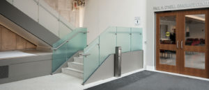 a doorway with a white terrazzo floor and terrazzo treads and risers