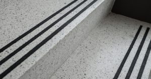 gray terrazzo treads and risers with three black abrasive strips