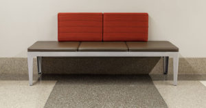 gray terrazzo straight base with a poured terrazzo floor and a red and brown bench