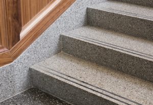 gray terrazzo step treads and risers with two black abrasive strips