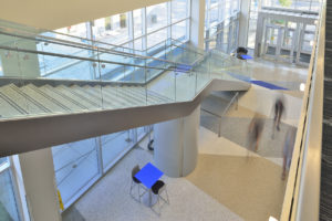 gray terrazzo stairs with a white, brown, and gray terrazzo floor