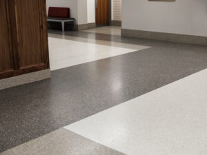terrazzo straight base with a black, white, and gray terrazzo floor