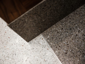 terrazzo straight base with a white and brown terrazzo floor and divider strip