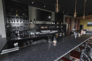 black terrazzo bar tops