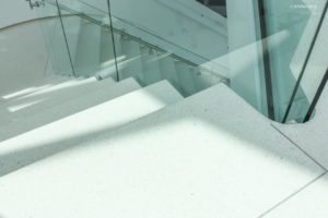 white terrazzo stair treads with divider strips