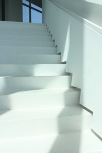 white terrazzo stair treads with white wall