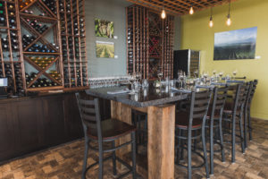 black terrazzo table top with wine glasses and napkins