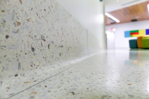 white terrazzo cove base with toe strip