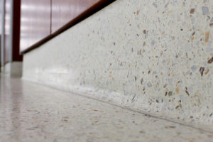 white terrazzo cove base with toe strip