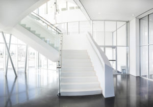 white terrazzo stair treads with polished concrete floor