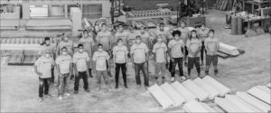venosa precast terrazzo team standing in the shop in grayscale